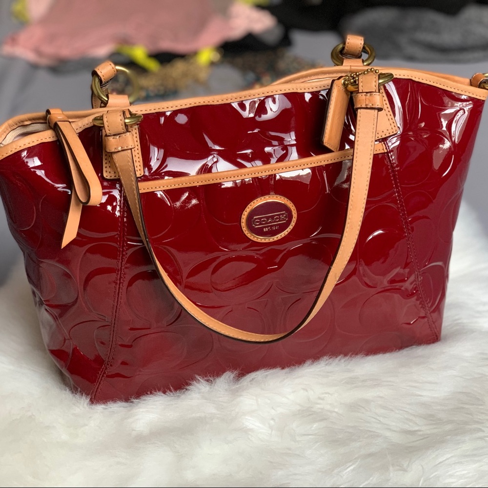 Coach crimson and tan patent leather tote.